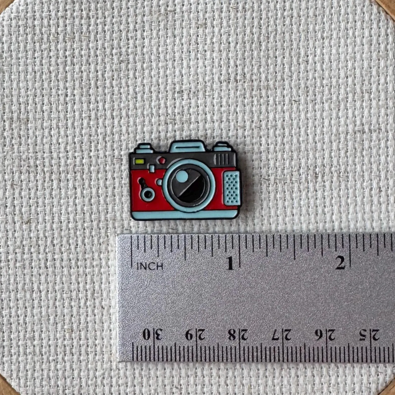 Red Camera Needle Minder